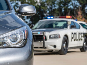 Police Vehicles Stop a Sedan